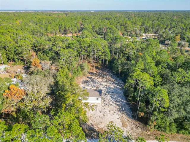 a view of a yard with an outdoor space