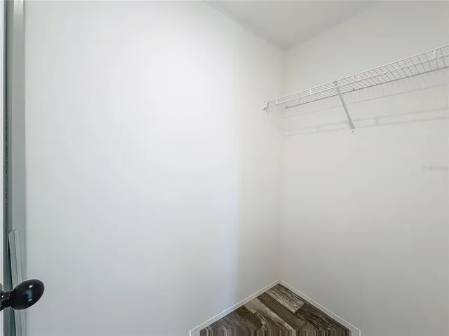 a bathroom with a granite countertop sink a toilet and a bathtub