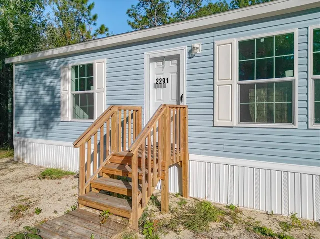 a view of two chairs in the balcony
