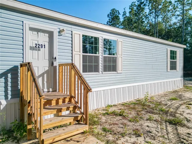 a view of a house with wooden floor