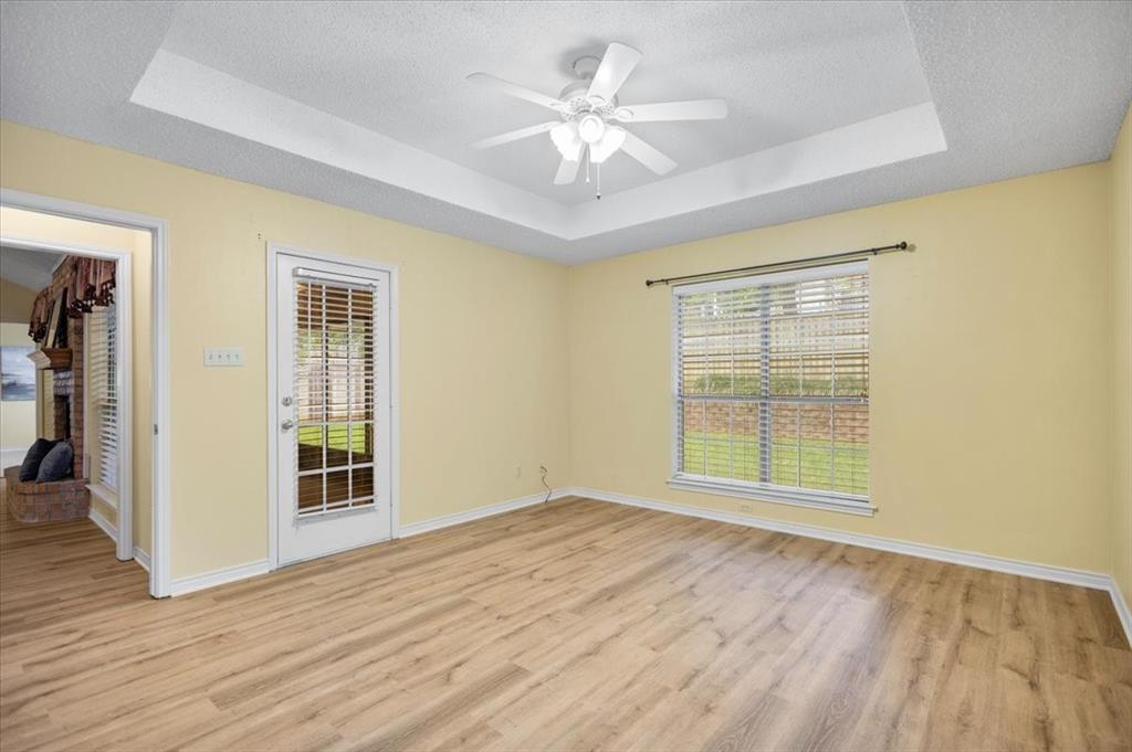 2824 Crestview Avenue Tyler, TX 75701 - Photo 25 of 39 an empty room with wooden floor and windows