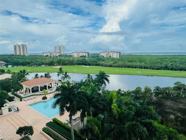 a view of a lake with houses in the back