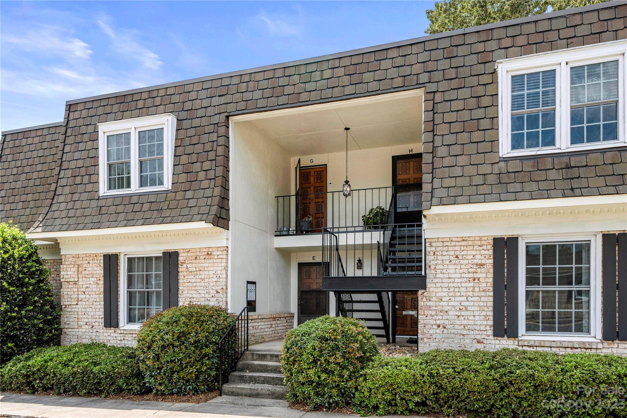 3520 Colony Road, Unit G Charlotte, NC 28211 - Photo 1 of 19 a front view of a house with glass windows