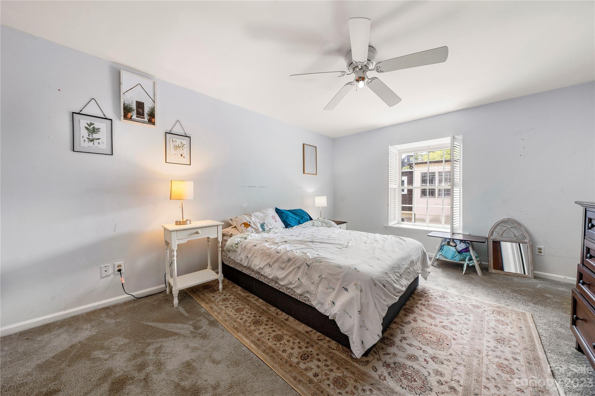 3520 Colony Road, Unit G Charlotte, NC 28211 - Photo 14 of 19 a bedroom with a bed and a table in it with window