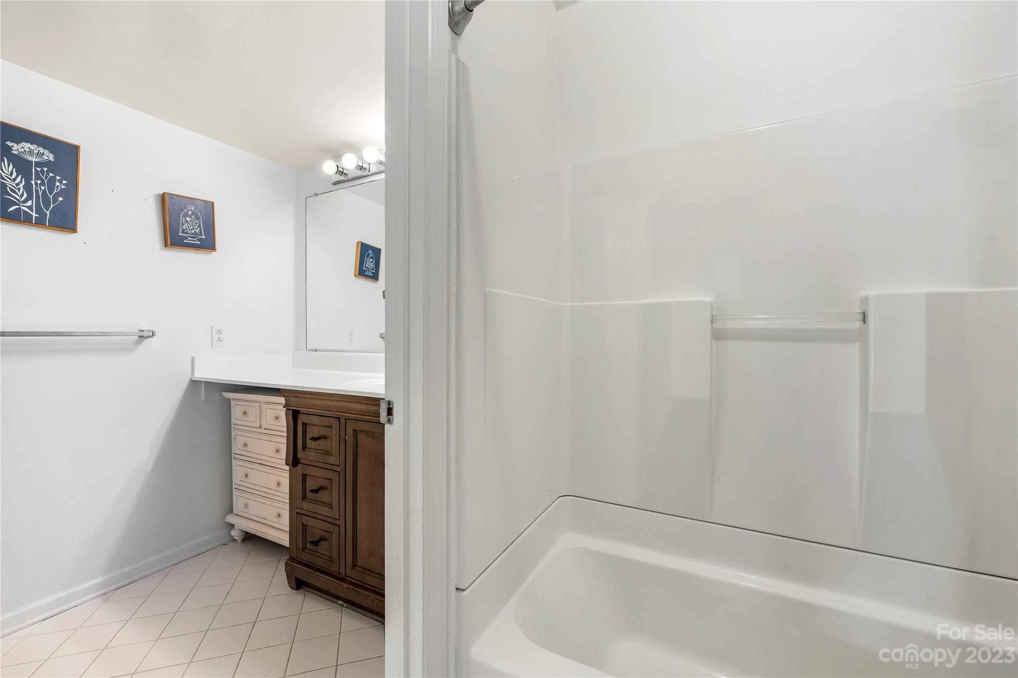 3520 Colony Road, Unit G Charlotte, NC 28211 - Photo 16 of 19 a bathroom with a bathtub and a shower