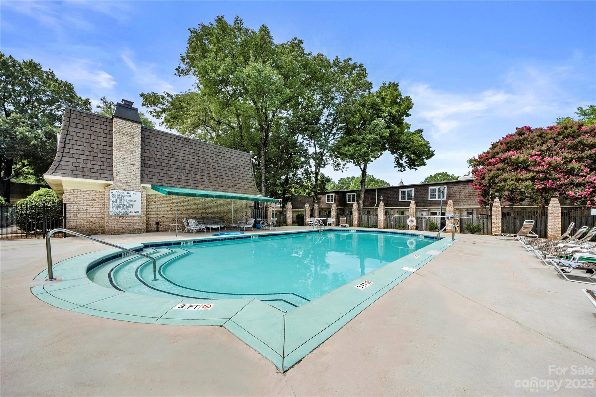 3520 Colony Road, Unit G Charlotte, NC 28211 - Photo 18 of 19 a view of a swimming pool with a patio