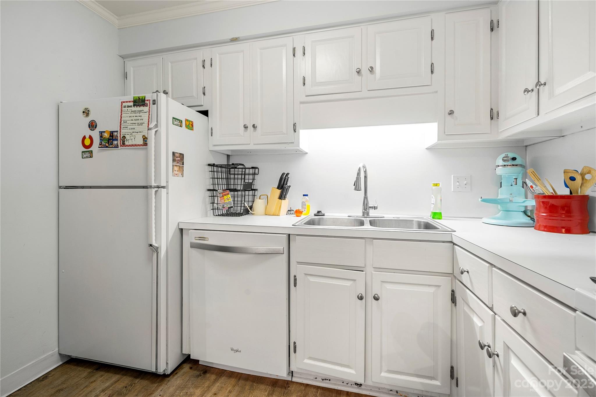 3520 Colony Road, Unit G Charlotte, NC 28211 - Photo 4 of 19 a kitchen with white cabinets and white appliances