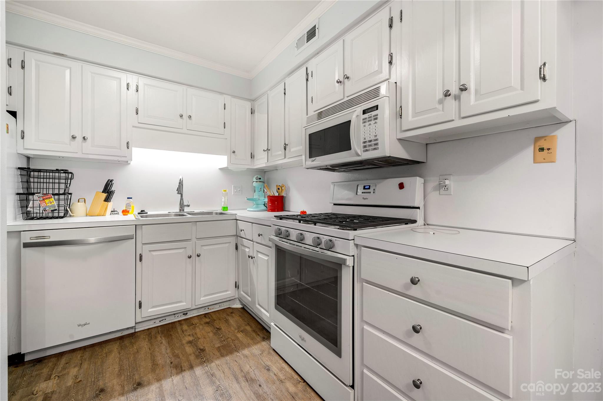 3520 Colony Road, Unit G Charlotte, NC 28211 - Photo 5 of 19 a kitchen with granite countertop white cabinets stainless steel appliances and sink