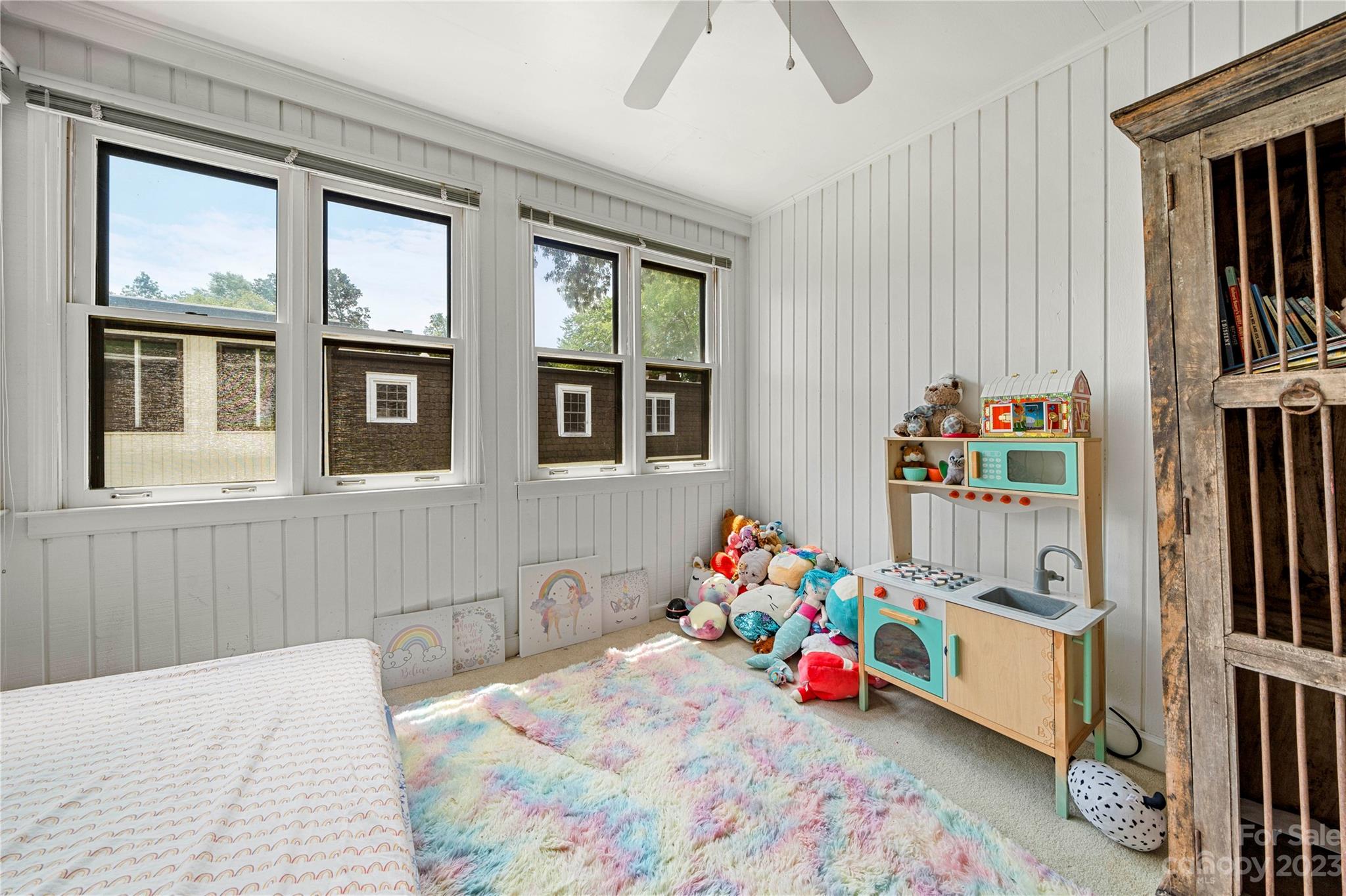 3520 Colony Road, Unit G Charlotte, NC 28211 - Photo 7 of 19 a bedroom with furniture and a wooden floor