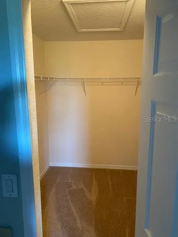 a bathroom with a granite countertop sink a mirror and vanity