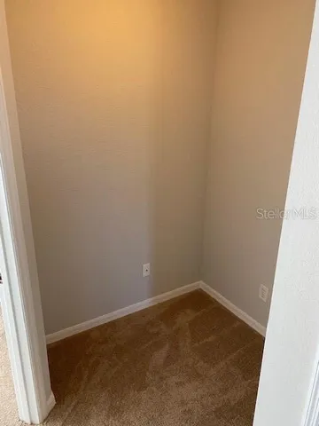 a white toilet and tub sitting next to a bathroom sink