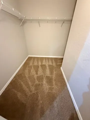 a bathroom with a double vanity sink and mirror