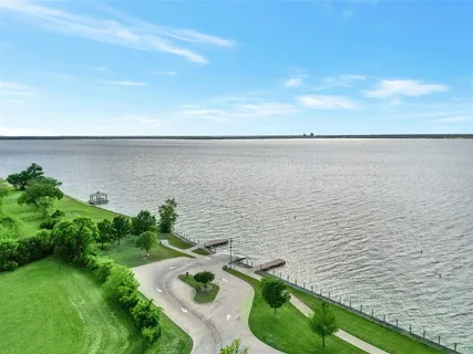 a view of a golf course with parking