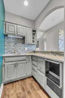 a bathroom with a toilet a sink and vanity
