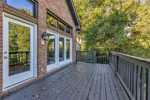 a balcony with wooden floor