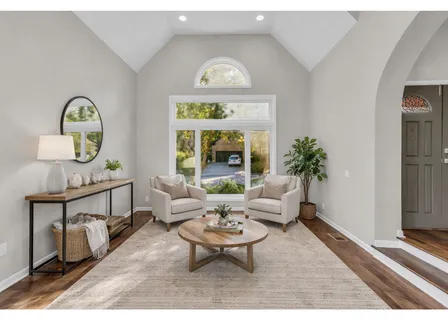 a living room with furniture and a rug