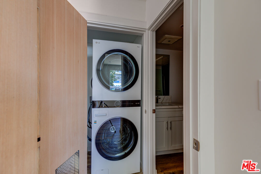 11906 Rochester Avenue Los Angeles, CA 90025 - Photo 7 of 13 a view of a hallway with washer and dryer