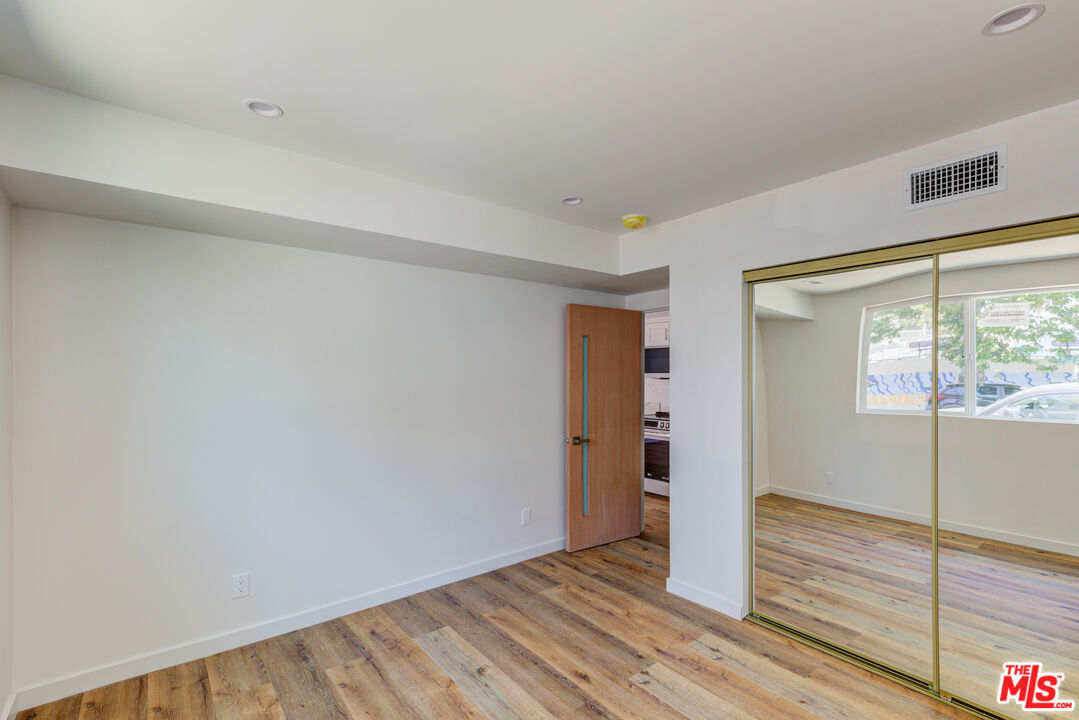 11906 Rochester Avenue Los Angeles, CA 90025 - Photo 9 of 13 a view of an empty room and window