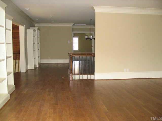 3124 Cone Manor Lane Raleigh, NC 27613 - Photo 7 of 10 a view of empty room with wooden floor