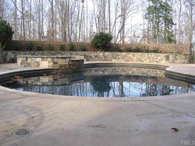 3124 Cone Manor Lane Raleigh, NC 27613 - Photo 8 of 10 a view of a swimming pool with a yard