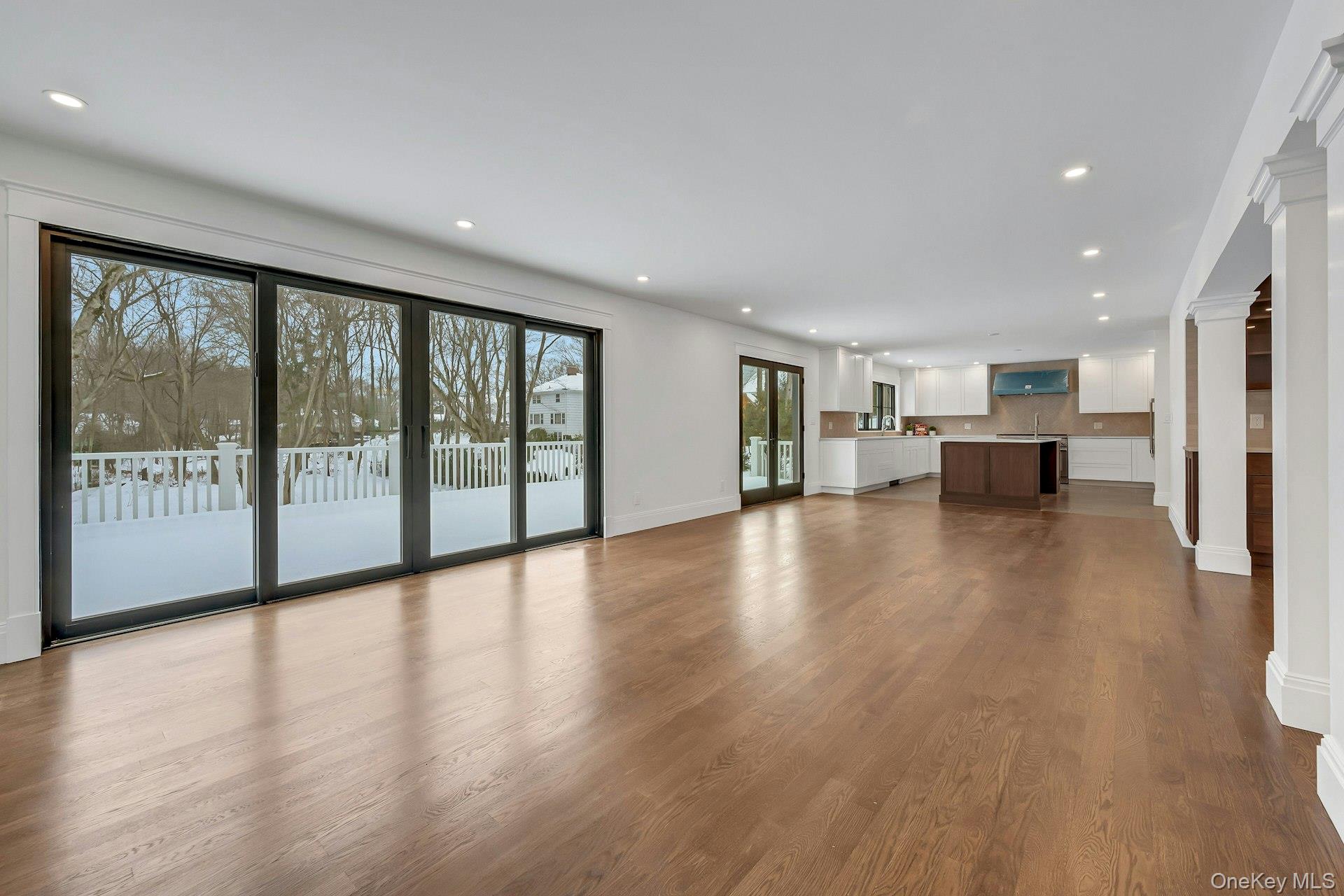 32 Sycamore Road Scarsdale, NY 10583 - Photo 11 of 48 Open concept family room looking into the breakfast area and kitchen with white oak floors