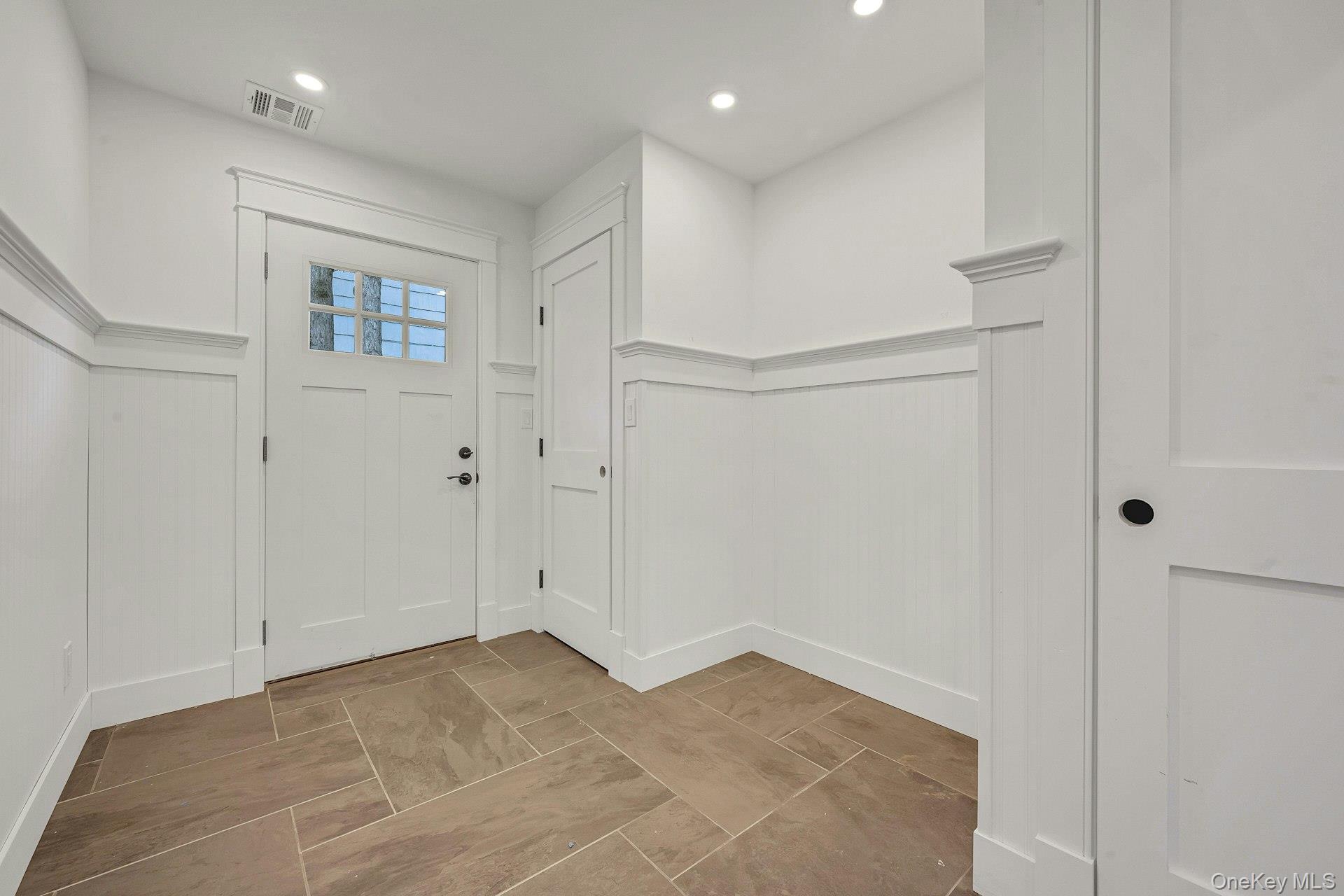 32 Sycamore Road Scarsdale, NY 10583 - Photo 15 of 50 Mudroom with side entrance and wainscoting on walls. Will be outfitted to suit.