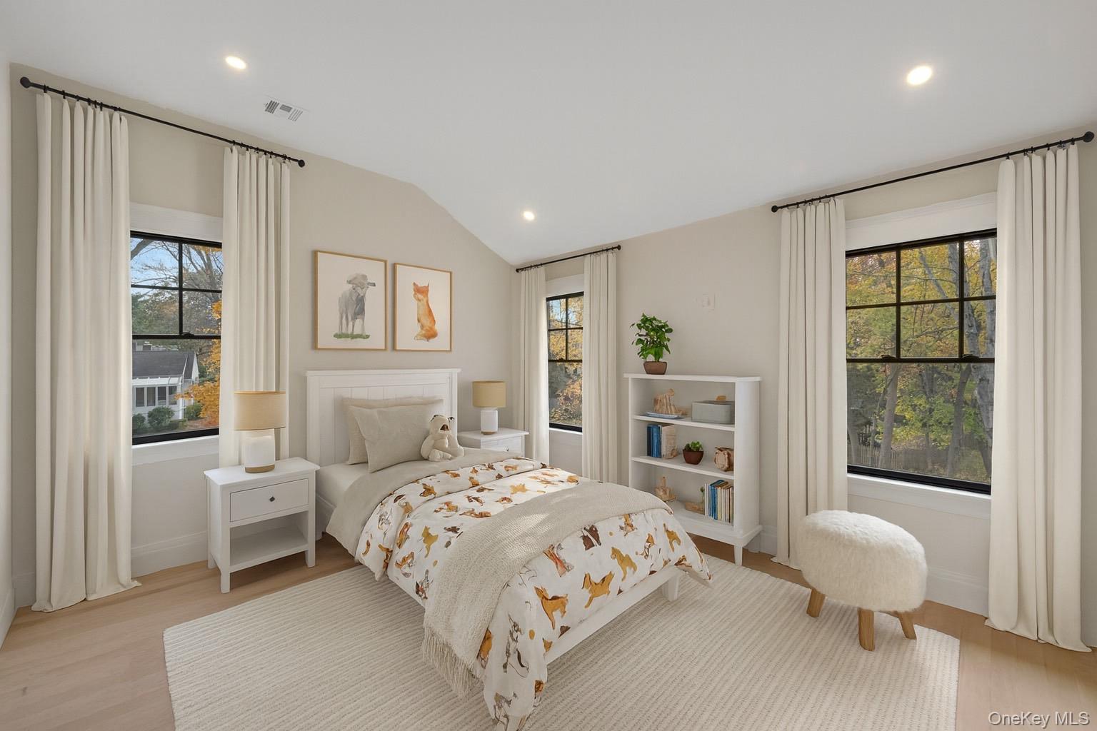 32 Sycamore Road Scarsdale, NY 10583 - Photo 30 of 48 virtually staged Bedroom featuring multiple windows, recessed lighting, light wood-style flooring, and lofted ceiling