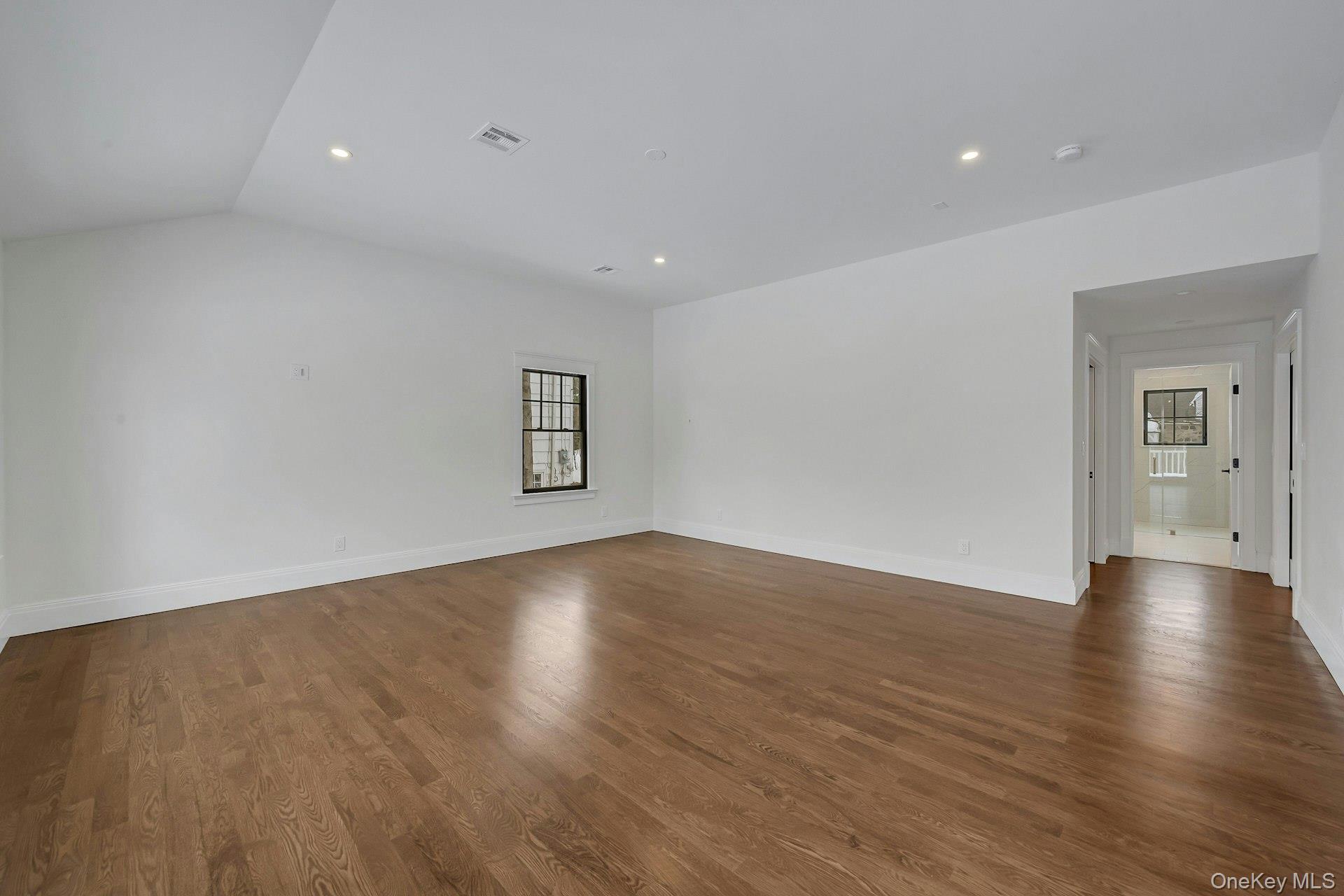 32 Sycamore Road Scarsdale, NY 10583 - Photo 39 of 48 Large Primary with high ceilings , bedroom overlooking wooded backyard