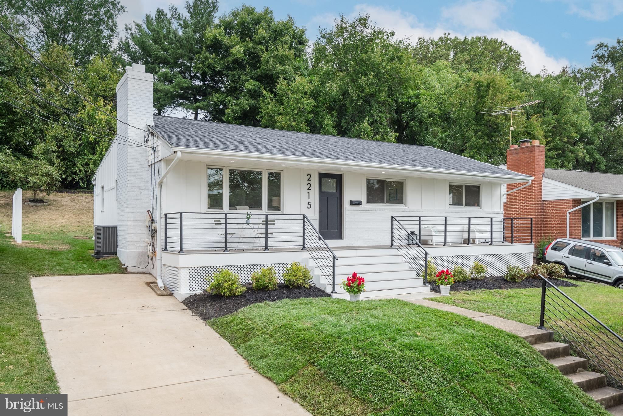 2215 Reedie Drive Silver Spring, MD 20902 - Photo 3 of 56 a front view of a house with garage