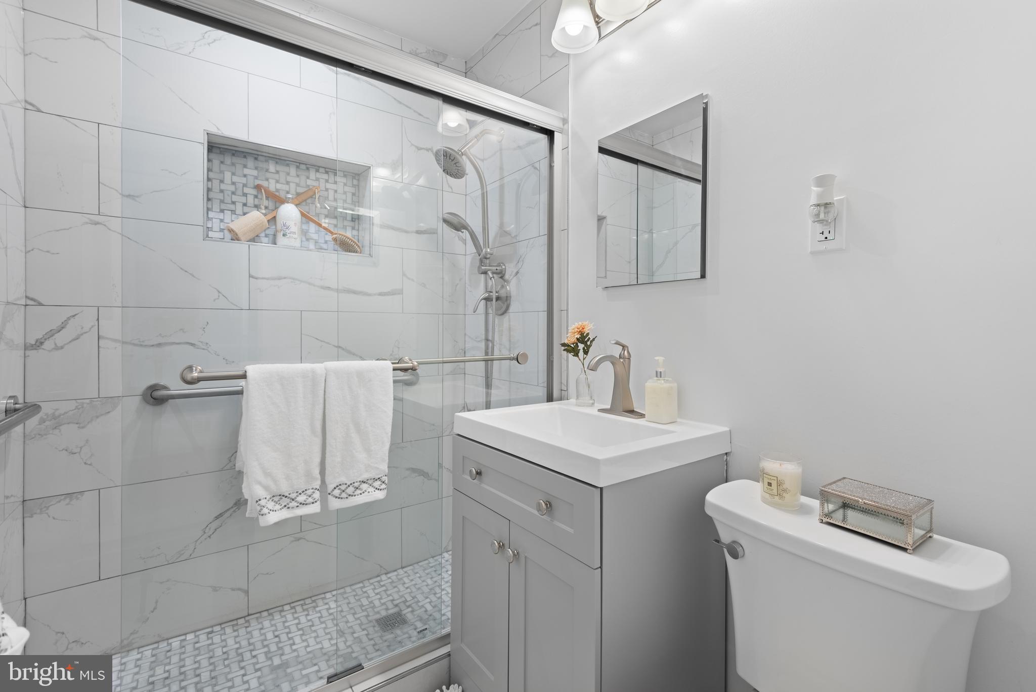 2215 Reedie Drive Silver Spring, MD 20902 - Photo 32 of 56 a bathroom with a sink toilet and vanity