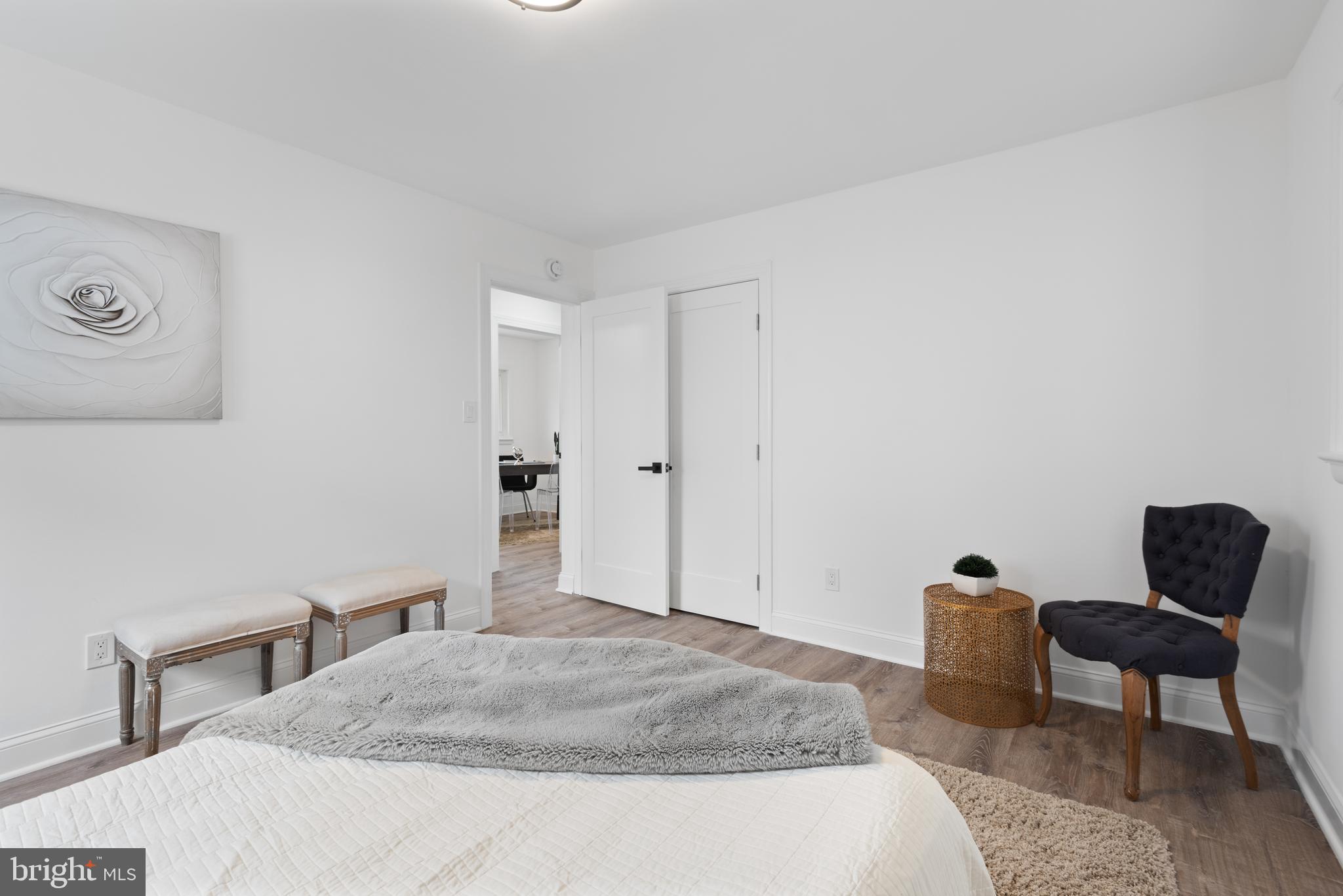 2215 Reedie Drive Silver Spring, MD 20902 - Photo 35 of 56 a bedroom with a bed and chair