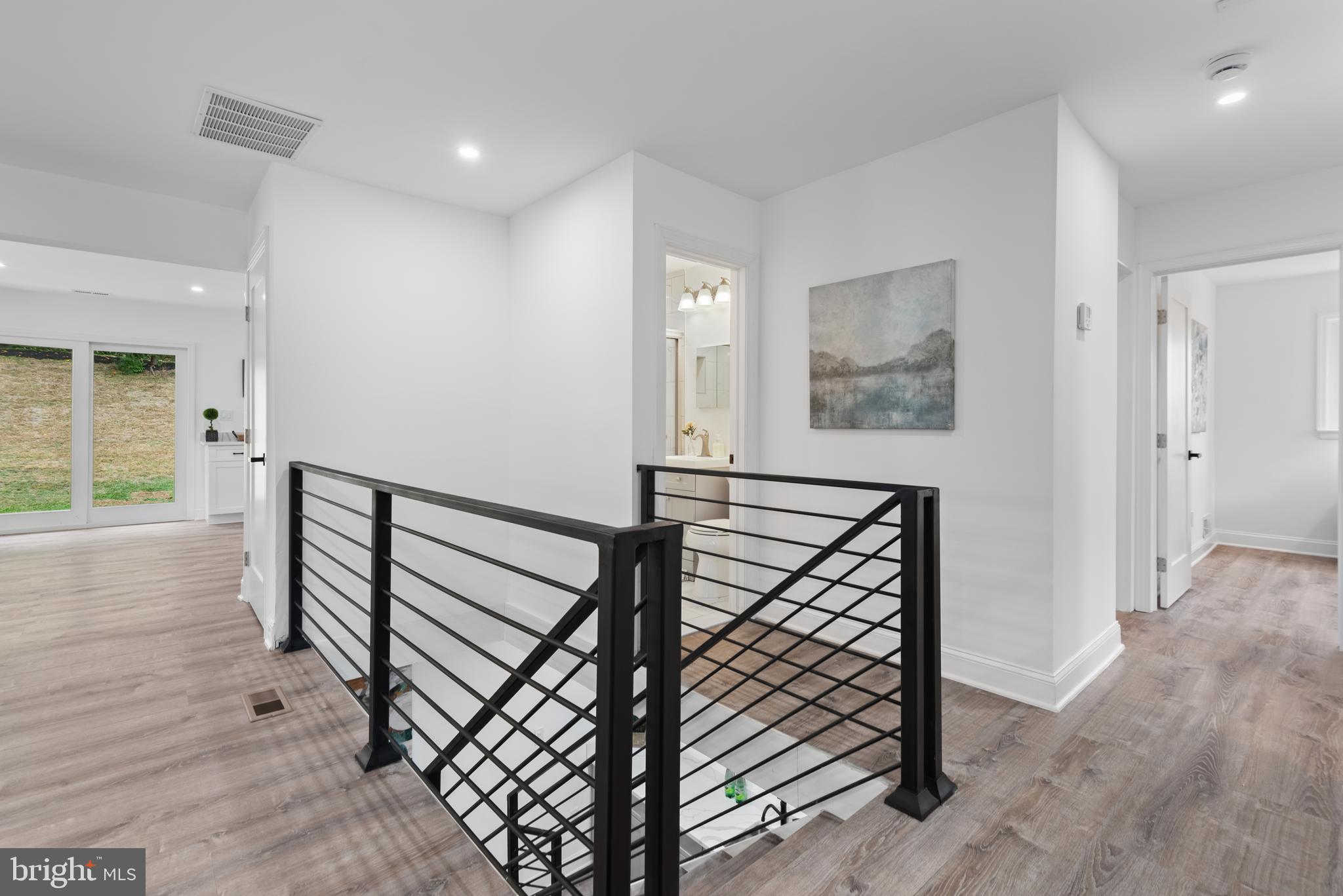2215 Reedie Drive Silver Spring, MD 20902 - Photo 36 of 56 a view of entryway with wooden floor and stairs