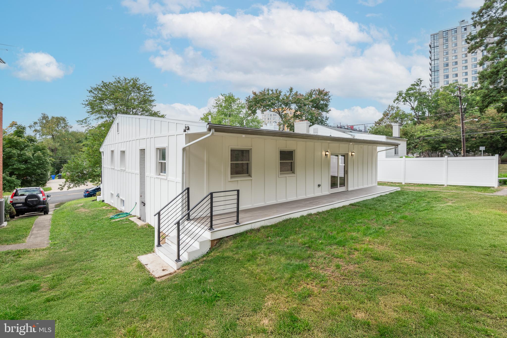 2215 Reedie Drive Silver Spring, MD 20902 - Photo 50 of 56 a view of a house with a yard and a garden