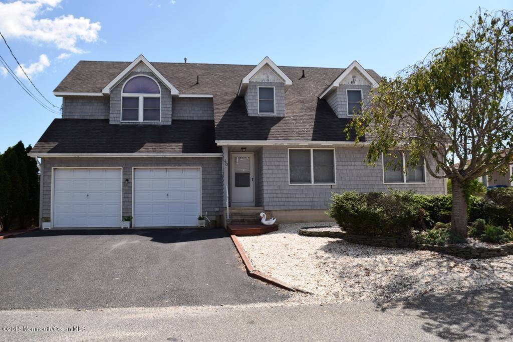 40 Compass Road Waretown, NJ 08758 - Photo 1 of 38 a front view of a house with a yard and garage