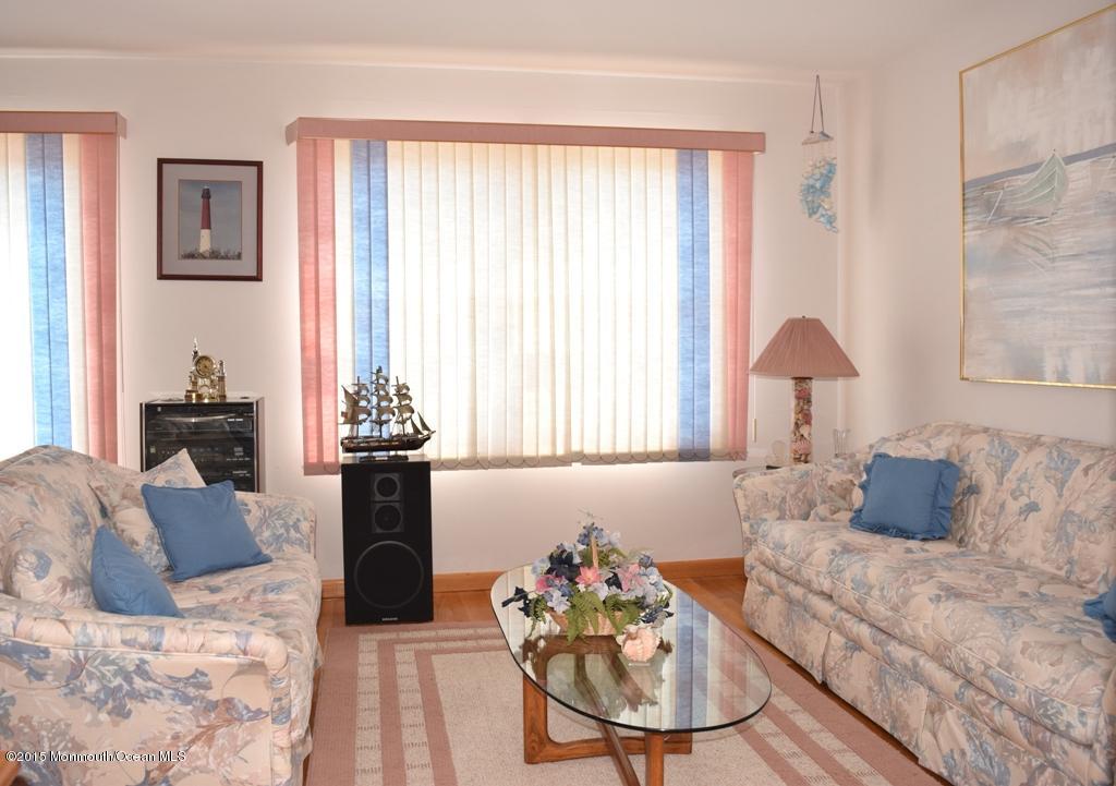 40 Compass Road Waretown, NJ 08758 - Photo 11 of 38 a living room with furniture and a large window