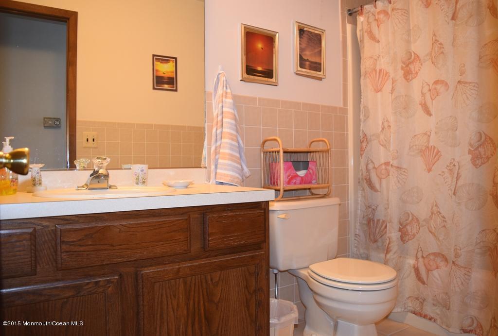 40 Compass Road Waretown, NJ 08758 - Photo 13 of 38 a bathroom with a sink and a toilet