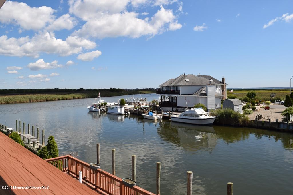 40 Compass Road Waretown, NJ 08758 - Photo 20 of 38 a view of a lake in middle of the house
