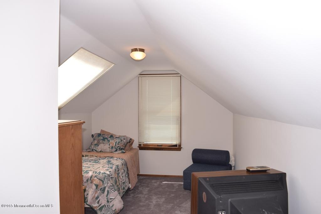 40 Compass Road Waretown, NJ 08758 - Photo 27 of 38 a bedroom with furniture and a window