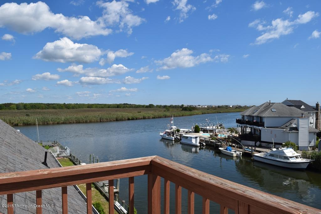 40 Compass Road Waretown, NJ 08758 - Photo 29 of 38 a view of a lake with a city