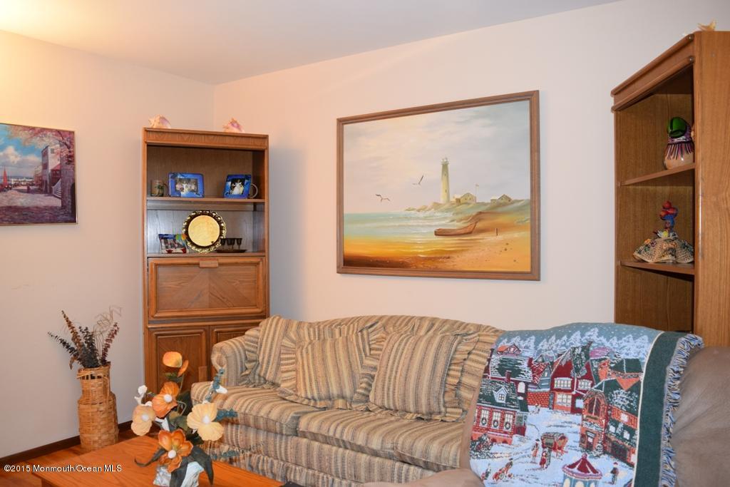 40 Compass Road Waretown, NJ 08758 - Photo 3 of 38 a bedroom with a bed and cupboard