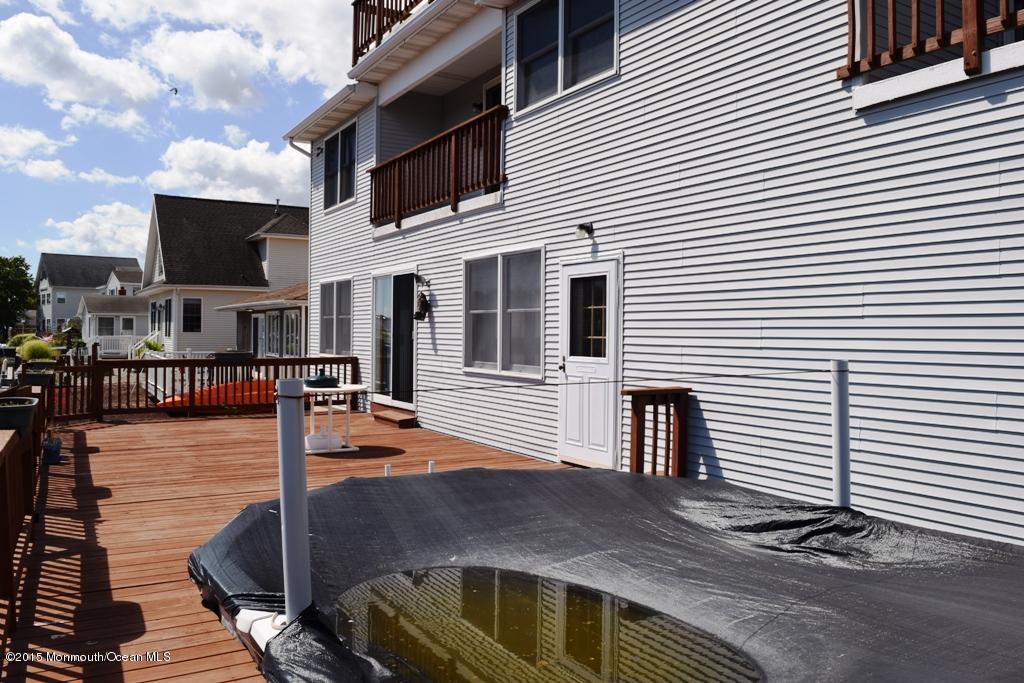 40 Compass Road Waretown, NJ 08758 - Photo 32 of 38 a front view of a house with street