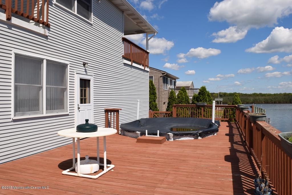 40 Compass Road Waretown, NJ 08758 - Photo 33 of 38 a backyard of a house with outdoor seating