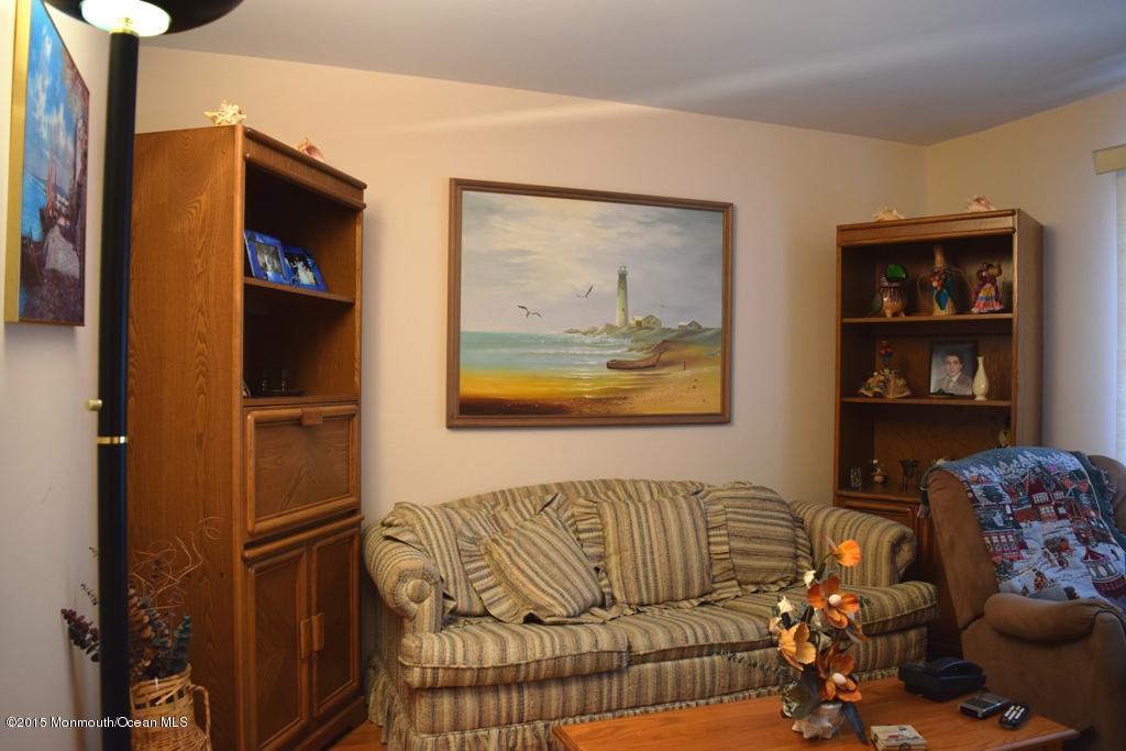 40 Compass Road Waretown, NJ 08758 - Photo 4 of 38 a living room with furniture a window and a flat screen tv