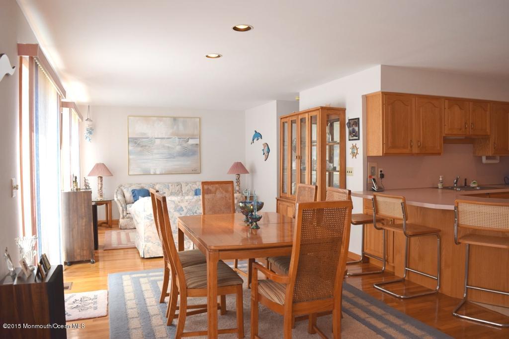40 Compass Road Waretown, NJ 08758 - Photo 9 of 38 a view of a dining room with furniture and wooden floor