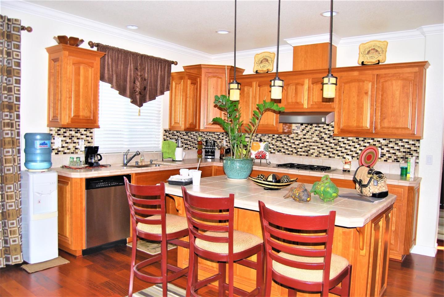 3532 Keystone Loop Discovery Bay, CA 94505 - Photo 15 of 37 a kitchen with a sink stove and chairs