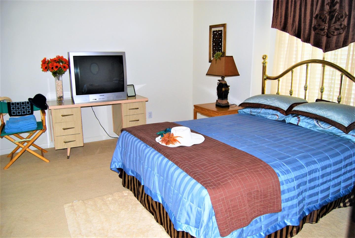 3532 Keystone Loop Discovery Bay, CA 94505 - Photo 21 of 37 a bedroom with a bed and a flat screen tv