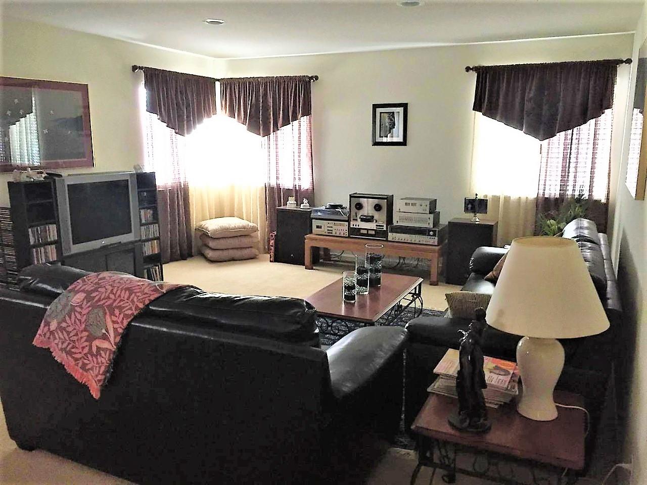 3532 Keystone Loop Discovery Bay, CA 94505 - Photo 24 of 37 a living room with furniture fireplace and window