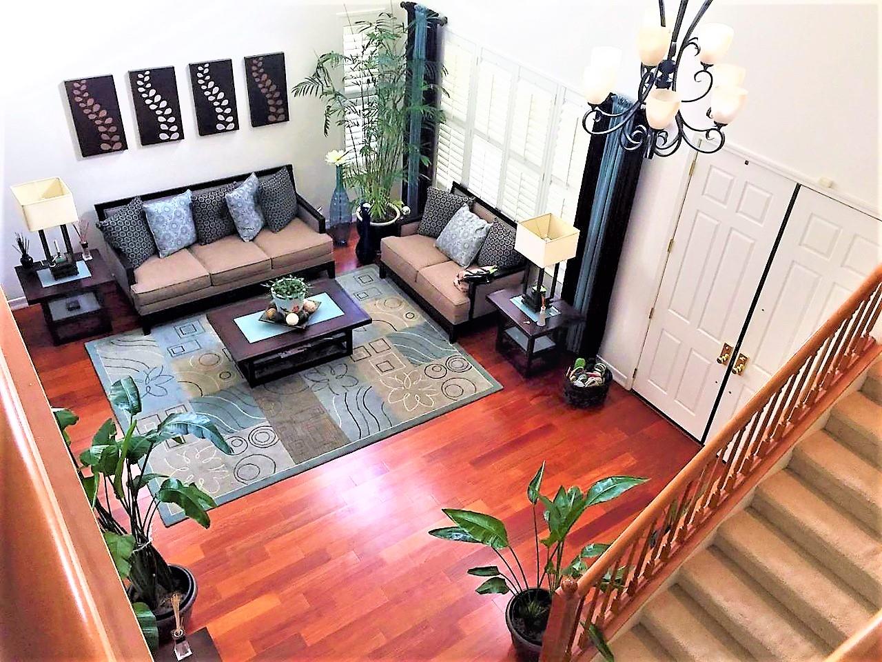 3532 Keystone Loop Discovery Bay, CA 94505 - Photo 6 of 37 a living room with furniture rug and a floor to ceiling window