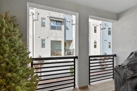 a bedroom with a bed and large window