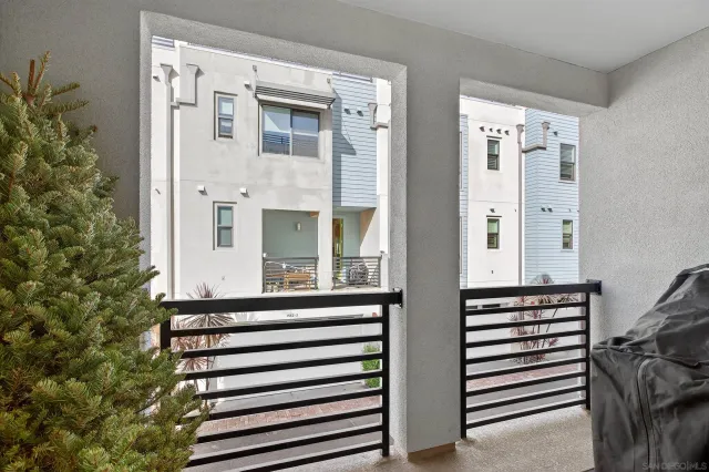 a bedroom with a bed and large window